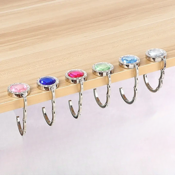 Gancho Plegable de Mesa para Bolso – Seguro, compacto y elegante