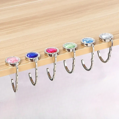 Gancho Plegable de Mesa para Bolso – Seguro, compacto y elegante